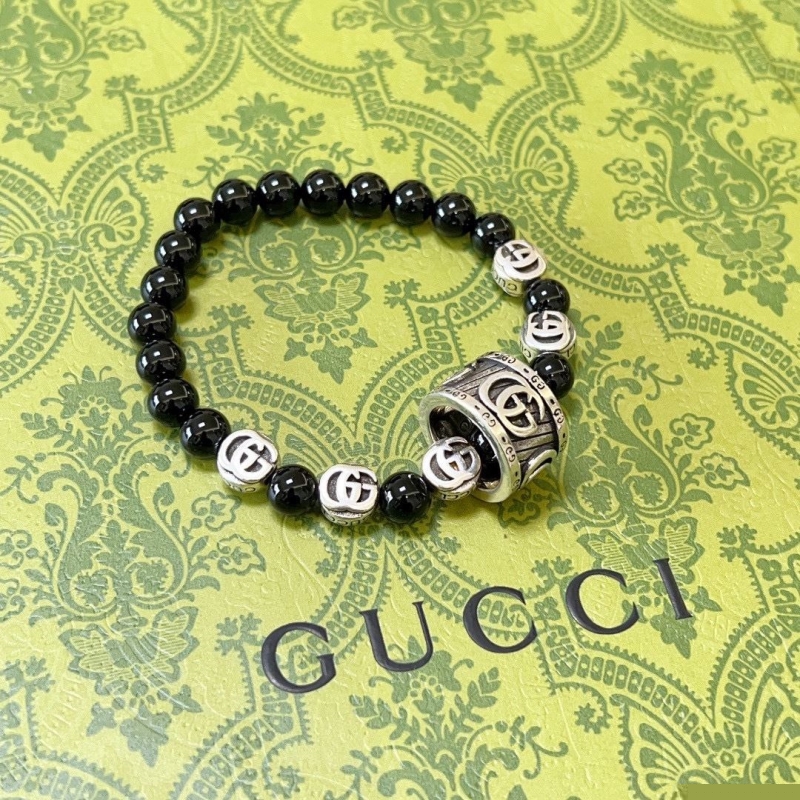 G*u*i bracelets